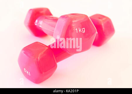 1 KG pink dumbbells isolated on a white background. Studio shot Stock Photo