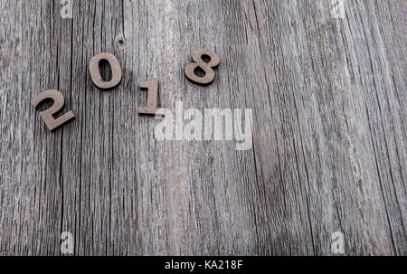 Figures 2018 on a wooden background. Stock Photo