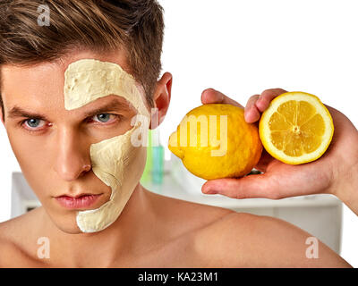 Facial man mask from fruits and clay . Face mud applied. Stock Photo