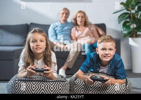 children playing video game Stock Photo