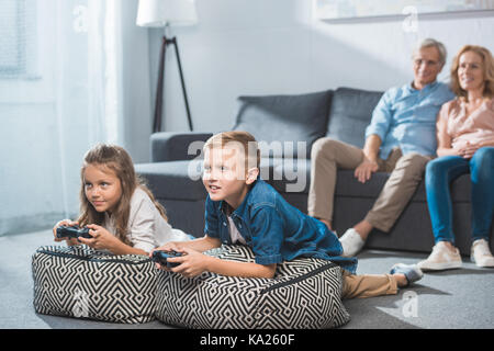 children playing video game Stock Photo