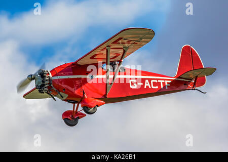 The Shuttleworth Collection's 1930 Comper Swift racer G-ACTF in a slight dive to the finish on Race Day2016 at Old Warden. Stock Photo