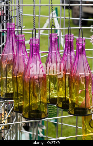 colourful decorative bottles hanging on a rack Stock Photo