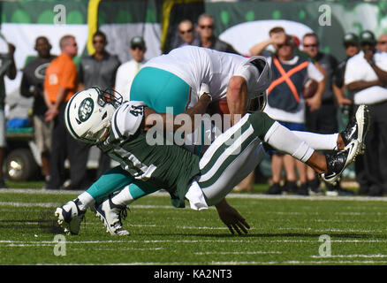 New York Jets Buster Skrine makes an interception in the first half against the New England Patriots in week 6 of the NFL at MetLife Stadium in East Rutherford New Jersey on