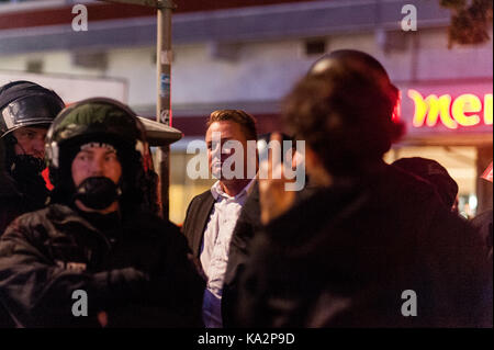 Berlin, Germany. 24th Sep, 2017. Several participants of the election party had to be escorted by policemen to a taxistand when they were surrounded by demonstrators. Several hundred people demonstrate in front of a club in Berlin, where the AfD is organizing its election party. On September 24, 2017 in Berlin, Germany. Credit: SOPA Images Limited/Alamy Live News Stock Photo