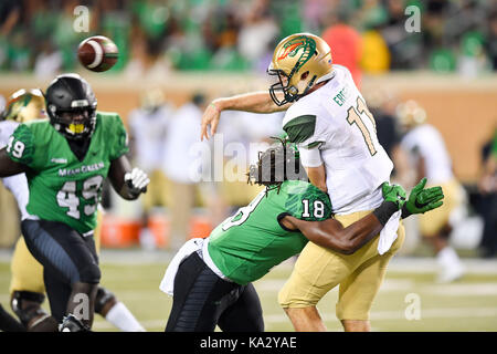 September 23, 2017: .UAB Blazers quarterback A.J. Erdely (11) is hit by North Texas Mean Green linebacker Joshua Wheeler (18).during an NCAA Football game between the Univerisity Alabama Birmingham Blazers and the North Texas Mean-Green Eagles at Apogee Stadium in Denton, Texas. Manny Flores/CSM Stock Photo