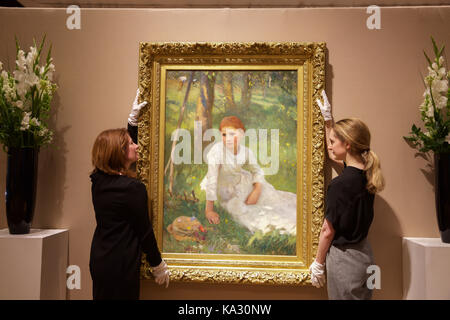 London,UK,25th August 2017,Noon in the Hayfield, by George Clausen, leads the photo call for Bonhams 19th Century European, Victorian and British Impressionist Art Sale. The sale itself takes place on Wednesday 27th September.©Keith Larby/Alamy Live News Stock Photo