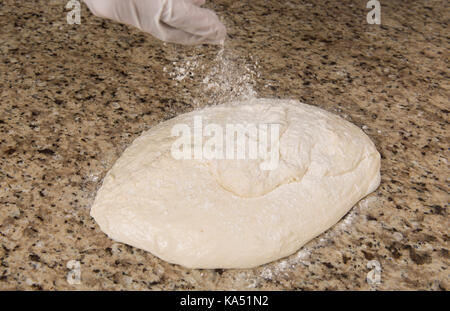 Sourdough sponge in preparation for making traditional bread without yeast. Stock Photo