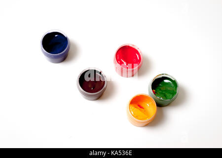 Color gouache jars on white background Stock Photo