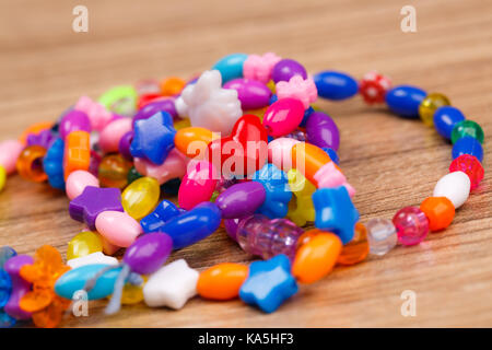 bead bracelet with beautiful handcrafted wooden background Stock Photo