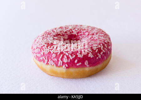 Brightly pink donut on white background Stock Photo