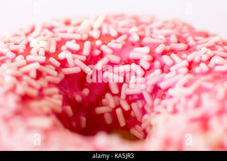 Brightly pink donut on white background. Macro. Selective focus Stock Photo