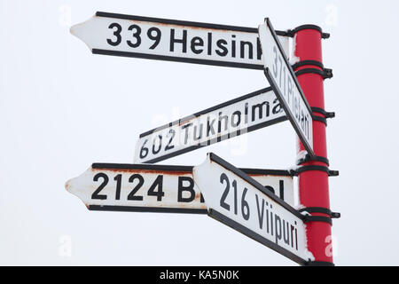 Red signpost, directional signs with distances to destination cities. Savonlinna, Finland Stock Photo