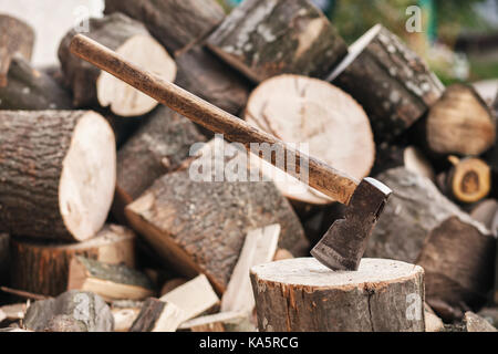 Axe stuck in a stump  Stock Photo