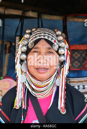 Closeup portrait of a woman pagan Akha tribe in traditional clothes and national silver jewelry. Stock Photo