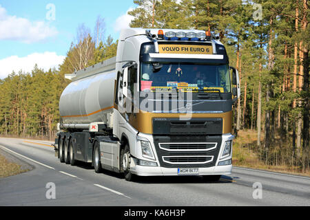 SALO, FINLAND - APRIL 21, 2017: Customized Volvo FH Euro 6 Zlota from Poland transports goods along rural highway at spring in South of Finland. Stock Photo