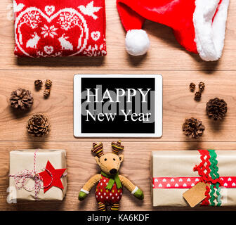 Desk view from above with digital tablet and presents, new year concept Stock Photo