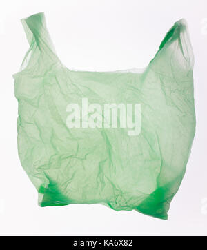 Green plastic bag isolated on white. Stock Photo