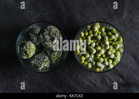 Healthy food frozen spinach and peas top view horizontal Stock Photo
