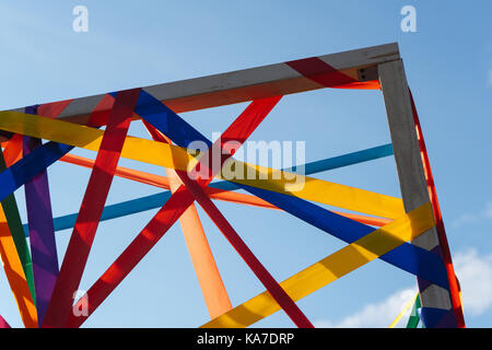 Frame of multi-colored ribbons against the blue sky horizontal Stock Photo