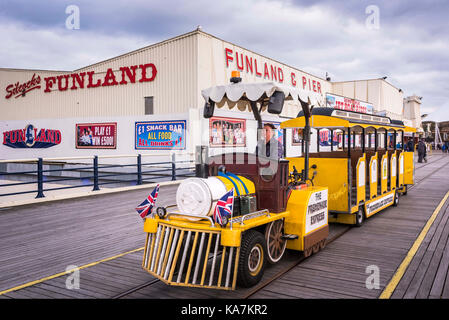 Southport Silcocks Funland on the pier with the pier train. Stock Photo