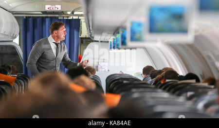 Istanbul, Turkey. 25th Sep, 2017. Leipzig's manager Ralph Hasenhüttl on board a flight to Istanbul that departed from Leipzig, Germany, 25 September 2017. The Bundesliga side face Turkish Süper Lig team Besiktas in a Champions League group stage match on the 26.09.17. Credit: dpa picture alliance/Alamy Live News Stock Photo