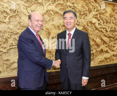 Beijing, China. 25th Sep, 2017. Chinese Vice Premier Wang Yang (R) meets with U.S. Secretary of Commerce Wilbur Ross in Beijing, capital of China, Sept. 25, 2017. Credit: Ding Lin/Xinhua/Alamy Live News