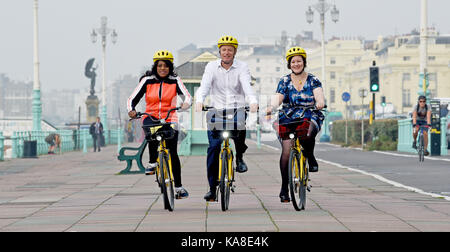 Brighton, UK. 26th Sep, 2017. Labour Party MPs from left Eleanor Smith, Luke Pollard and Meg Hillier take part in a cycle ride along Brighton seafront on ofo station-free bikes to raise money for the British Heart Foundation during this weeks Labour Party Conference in the city Credit: Simon Dack/Alamy Live News Stock Photo
