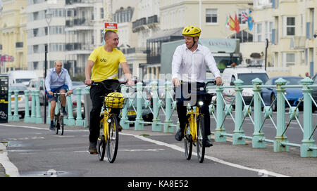 Brighton, UK. 26th Sep, 2017. Labour Party MP Luke Pollard (right) takes part in a cycle ride along Brighton seafront on ofo station-free bikes to raise money for the British Heart Foundation during this weeks Labour Party Conference in the city Credit: Simon Dack/Alamy Live News Stock Photo