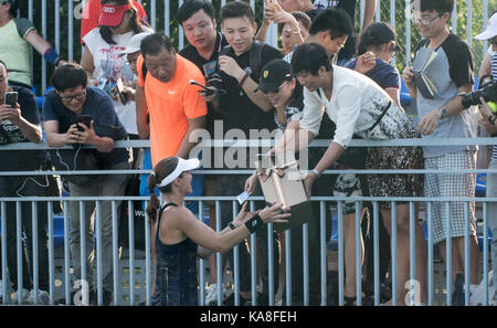 Wuhan, China. 26th Sep, 2017. Supporters give a box of gifts to Martina Hingis of Switzerland after her doubles second round match against Raquel Atawo of the United States and Darija Jurak of Croatia at 2017 WTA Wuhan Open in Wuhan, capital of central China's Hubei Province, on Sept. 26, 2017. Hingis and her partner Chan Yung-Jan of Chinese Taipei  won 2-0. Credit: Xinhua/Alamy Live News Stock Photo