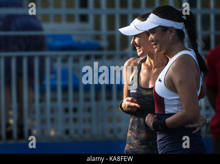 Wuhan, China. 26th Sep, 2017. Chan Yung-Jan (R) of Chinese Taipei and Martina Hingis of Switzerland celebrate after the doubles second round match against Raquel Atawo of the United States and Darija Jurak of Croatia at 2017 WTA Wuhan Open in Wuhan, capital of central China's Hubei Province, on Sept. 26, 2017. Chan and Hingis won 2-0. Credit: Xinhua/Alamy Live News Stock Photo