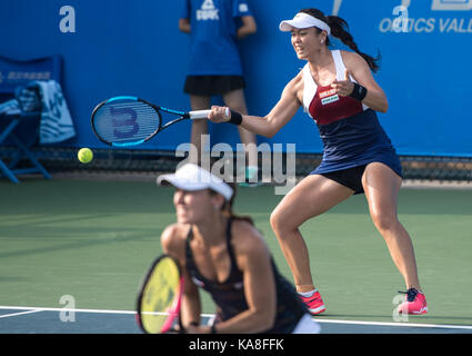 Wuhan, China. 26th Sep, 2017. Chan Yung-Jan (R) of Chinese Taipei and Martina Hingis of Switzerland return the ball during the doubles second round match against Raquel Atawo of the United States and Darija Jurak of Croatia at 2017 WTA Wuhan Open in Wuhan, capital of central China's Hubei Province, on Sept. 26, 2017. Chan and Hingis won 2-0. Credit: Xinhua/Alamy Live News Stock Photo