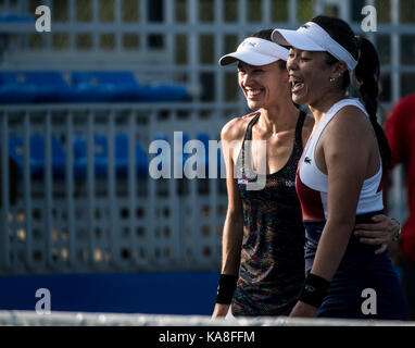 Wuhan, China. 26th Sep, 2017. Chan Yung-Jan (R) of Chinese Taipei and Martina Hingis of Switzerland celebrate after the doubles second round match against Raquel Atawo of the United States and Darija Jurak of Croatia at 2017 WTA Wuhan Open in Wuhan, capital of central China's Hubei Province, on Sept. 26, 2017. Chan and Hingis won 2-0. Credit: Xinhua/Alamy Live News Stock Photo