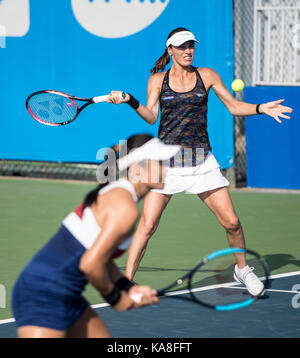Wuhan, China. 26th Sep, 2017. Chan Yung-Jan of Chinese Taipei and Martina Hingis (R) of Switzerland return the ball during the doubles second round match against Raquel Atawo of the United States and Darija Jurak of Croatia at 2017 WTA Wuhan Open in Wuhan, capital of central China's Hubei Province, on Sept. 26, 2017. Chan and Hingis won 2-0. Credit: Xinhua/Alamy Live News Stock Photo