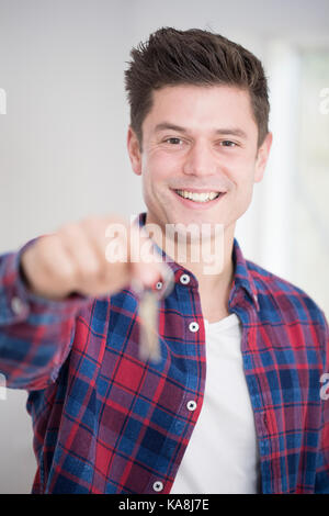 Man Moving Into New Home Holding Bunch Of Keys Stock Photo