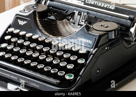 German 'Continentai' typewriter circa 1940s. Logos on front and carriage, green return keys, other black. Stock Photo