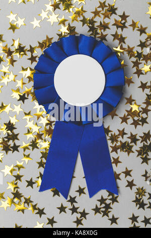 First place award rosette with gold stars. Success achievement concept Stock Photo