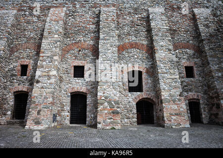 Slovakia, Bratislava, Bratislava Castle fortification, high stone and brick wall with buttresses and arches Stock Photo