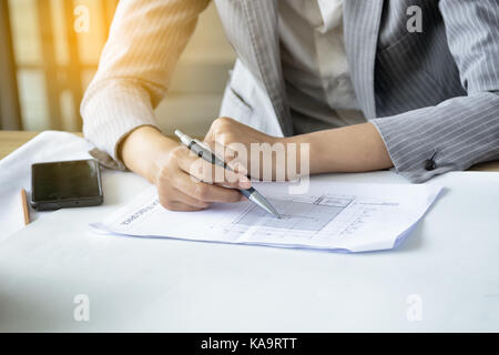 Hands of architect engineer meeting and discussing plan for architectural project. Stock Photo