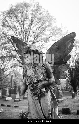 RAHWAY, NEW JERSEY - April 28, 2017: Details of an angel statue atop a grave at Rahway Cemetery Stock Photo