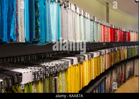 Swatches of material grouped by colour Stock Photo