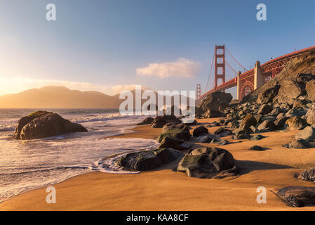 Golden Gate Bridge from the beach in San Francisco at sunset. Stock Photo
