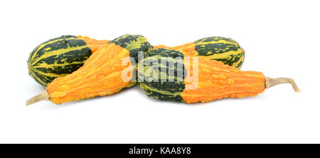 Four pear-shaped ornamental gourds with bold orange and green stripes lying flat, isolated on a white background Stock Photo