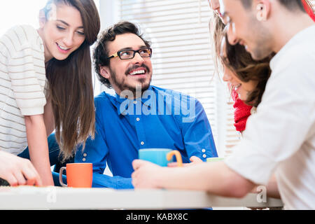 Team in creative agency discussing in meeting Stock Photo