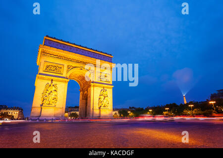 Illuminated Arc de Triomphe at night, Paris Stock Photo