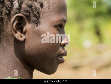Bodi girl attending Kael ceremony, Gurra, Omo Valley, Ethiopia Stock Photo