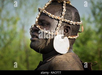 Bodi tribe men dancing during Kael ceremony, Gurra, Hana Mursi, Omo Valley, Ethiopia Stock Photo