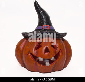 A smiling, ceramic jack o lantern with a witch's hat Stock Photo