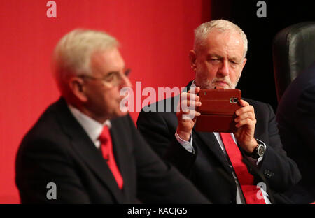 Labour leader Jeremy Corbyn takes a photography of Shadow Chancellor of the Exchequer John McDonnell. Stock Photo
