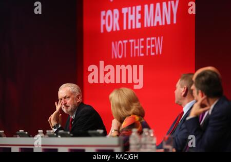 Labour Party leader Jeremy Corbyn waves to someone whilest on stage during the second day of the Labour Party Conference - 25 Sep 2017 Stock Photo